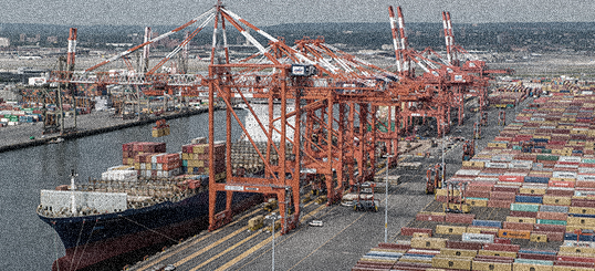 Container port with cranes and stacked shipping containers
